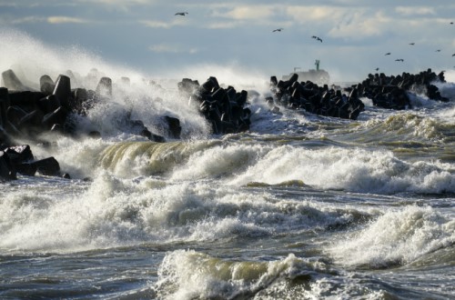 Stormy seas crashing over a breakwater